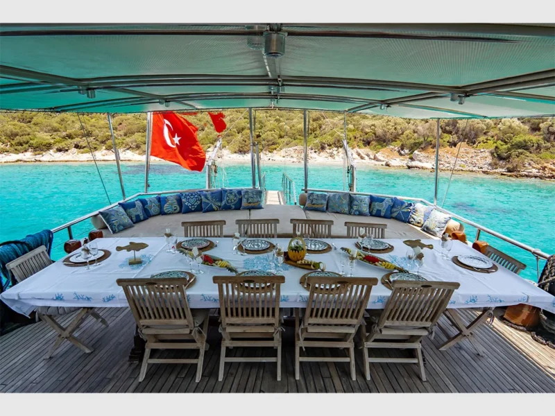 Ametist A gulet outdoor aft deck dining table and lounge area