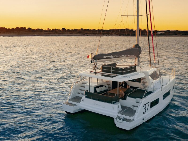Drone shot of Aventura 37 catamaran at sunset