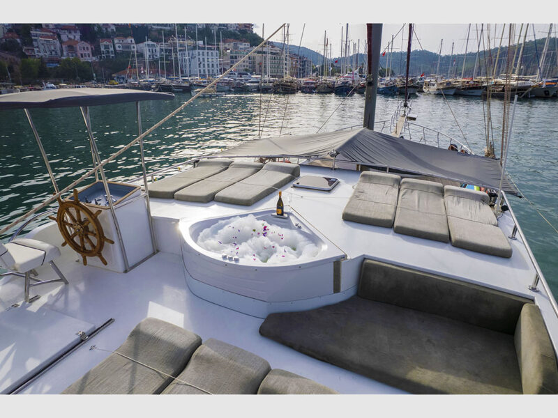 Diamond Lila charter gulet outdoor upper deck sunbeds, jacuzzi and wheel house