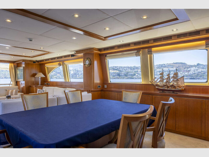 Sanref Falcon 115 charter yacht interior saloon dining table