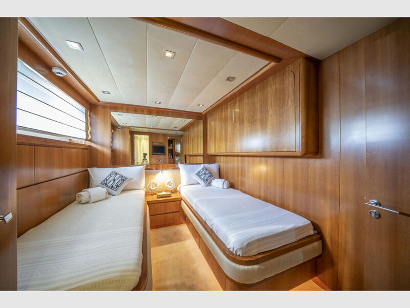 Sanref Falcon 115 charter yacht interior lower deck twin cabin with pullman bed closed