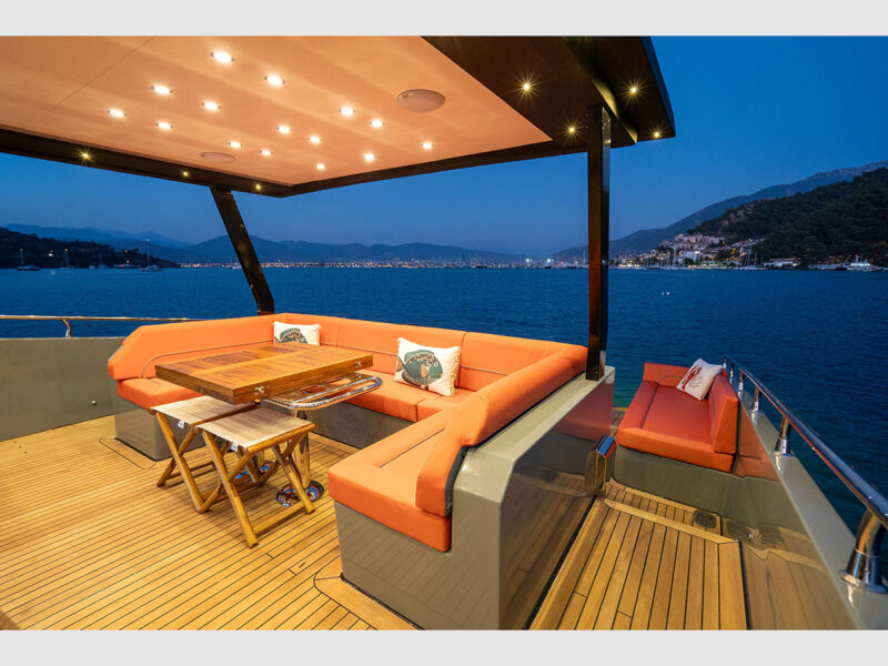 Gottiri yacht outdoor aft deck seating in the evening