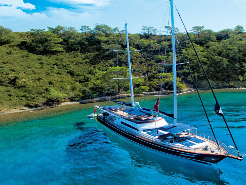Maske-2 charter gulet exterior drone shot stern-to-shore