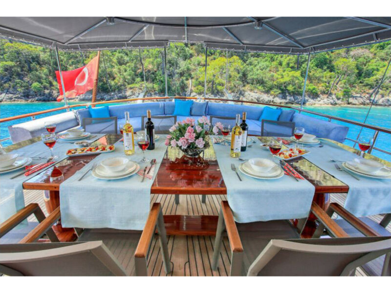 Maya charter gulet outdoor aft deck dining table
