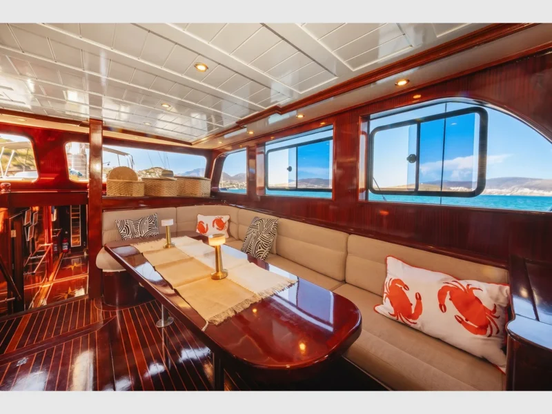 Perla Del Mar 1 gulet interior saloon lounge area with dining table