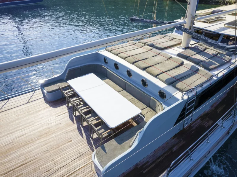 Prenses Lila gulet charter yacht exterior close-up aerial drone shot of fore deck, sunbeds and lounge area