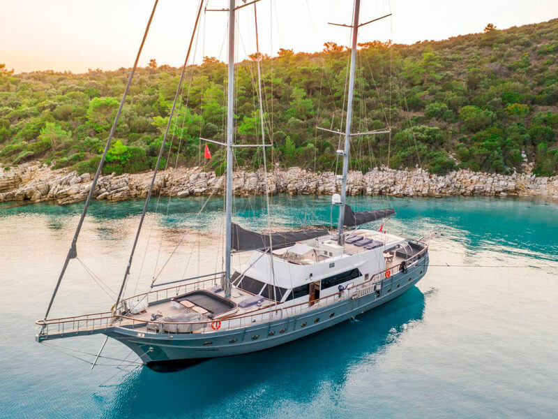 Virtuoso charter gulet exterior drone shot at anchor from port bow quarter