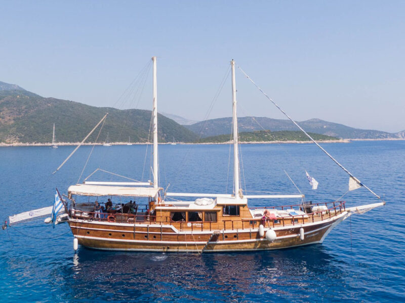 Rhodes blue cruise gulet exterior drone shot starboard side