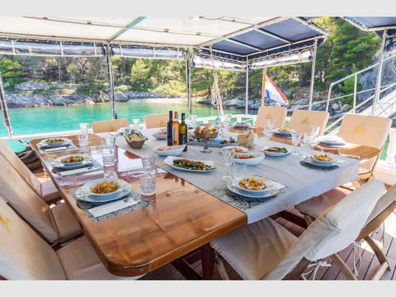 Gideon gulet Croatia charter yacht outdoor aft deck dining table