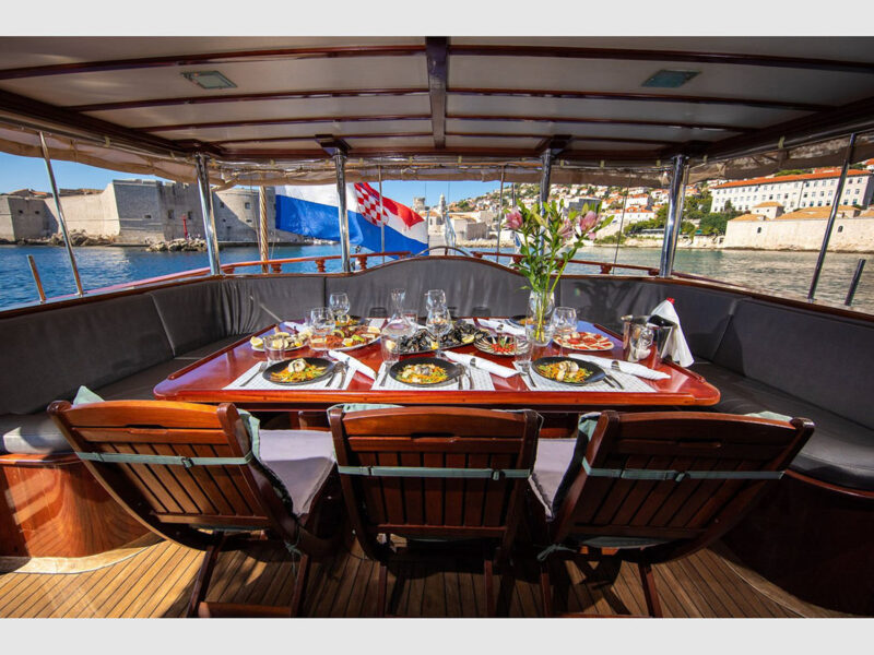 Phoenix Bronze charter gulet outdoor aft deck dining table
