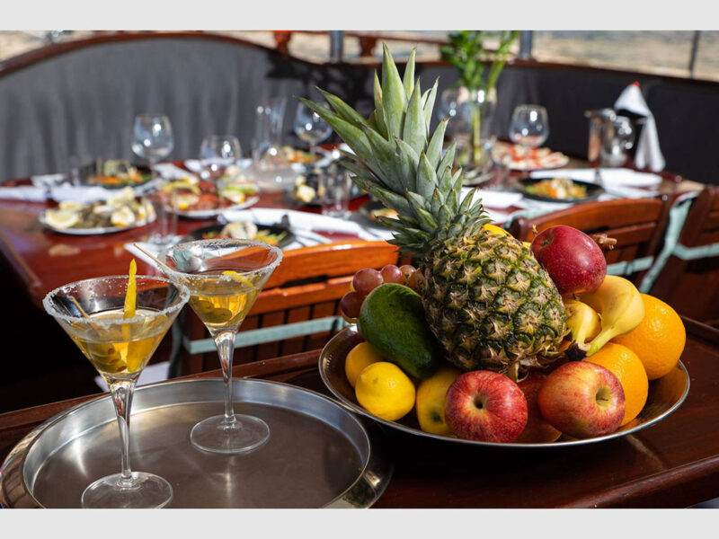 Phoenix Bronze charter gulet fruit plate and cocktail presentation