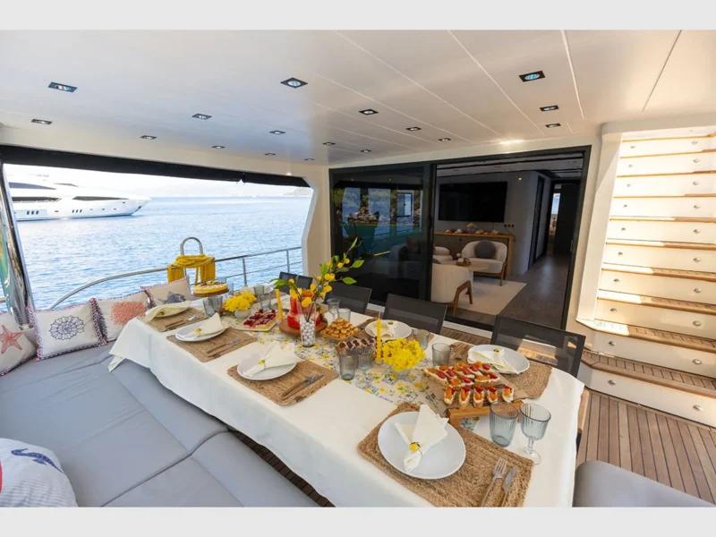 Akya-S trawler charter yacht outdoor aft deck dining table
