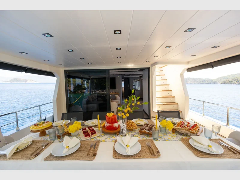 Akya-S trawler charter yacht outdoor aft deck dining table close-up