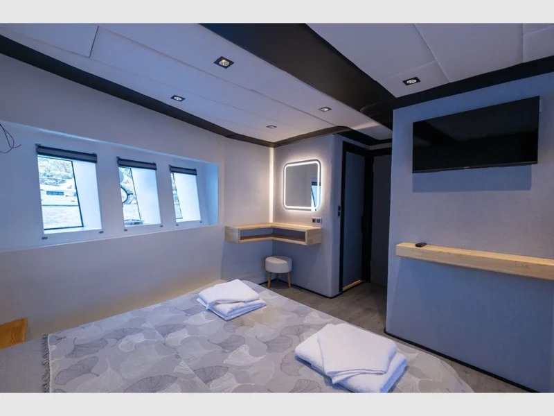 Akya-S trawler charter yacht interior lower deck VIP cabin vanity table and TV unit