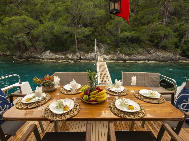 Golden Blue motor yacht outdoor aft deck dining table