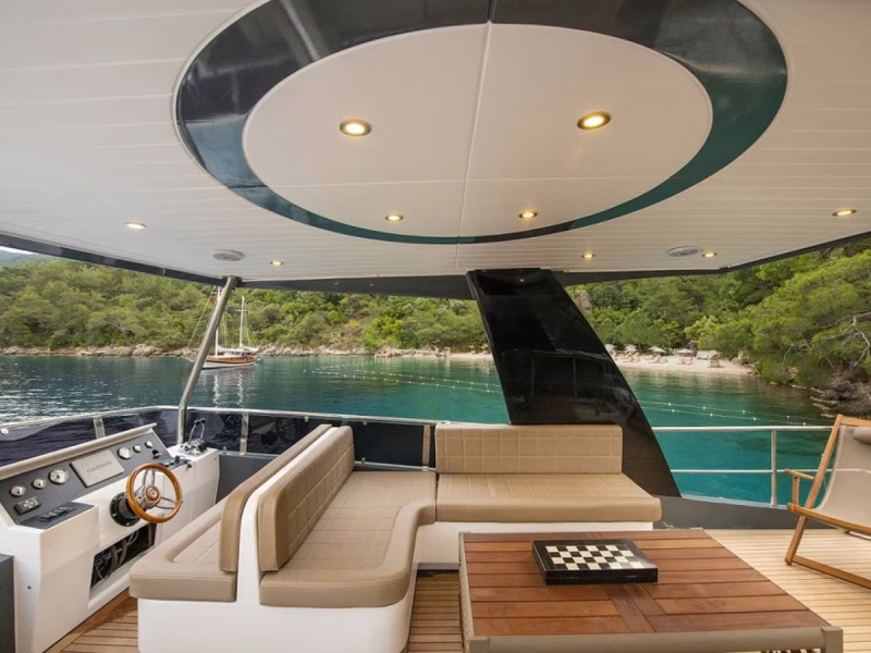 Golden Blue motor yacht outdoor upper deck wheel house and lounge area