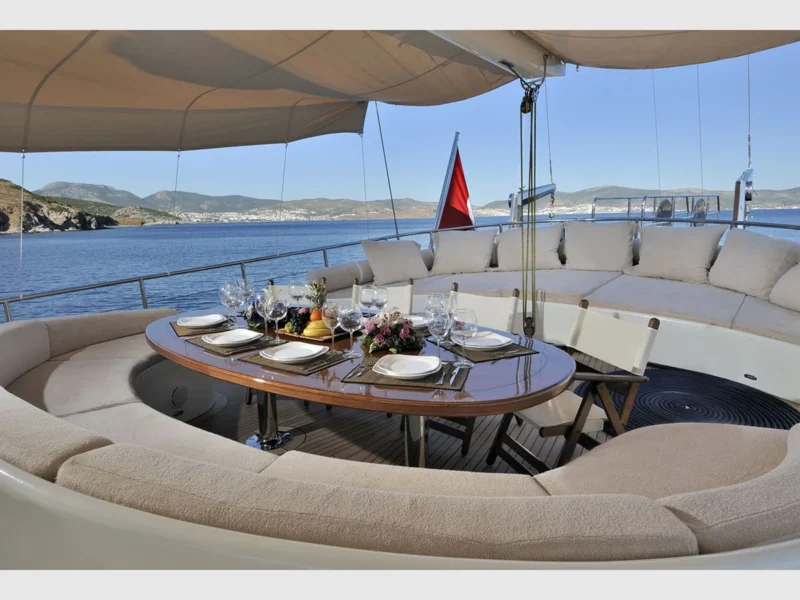 Dolce Mare gulet charter yacht outdoor aft deck dining table and lounge area