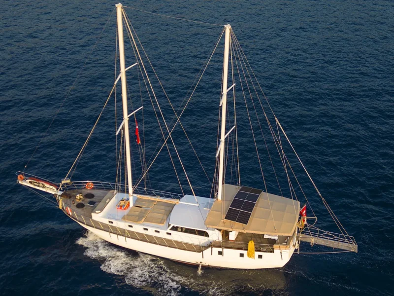 Flores gulet charter yacht in Fethiye and Gocek drone shot from port side while cruising