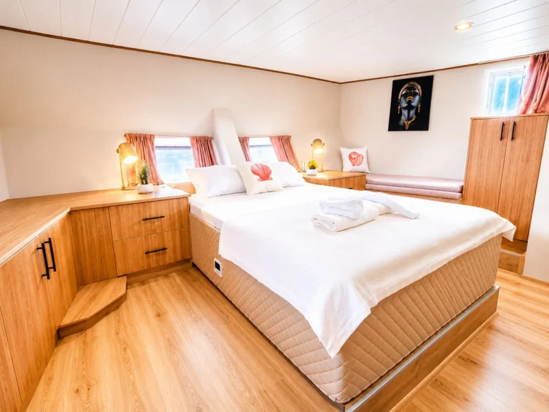 Flores gulet charter yacht interior aft master cabin wide angle