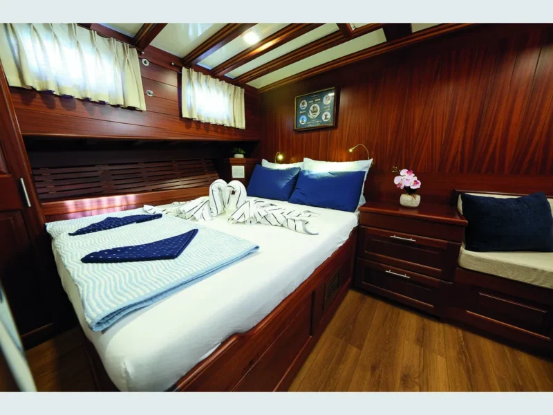 Kuzey Y gulet Bodrum yacht charter, interior master cabin with a double bed and a sofa