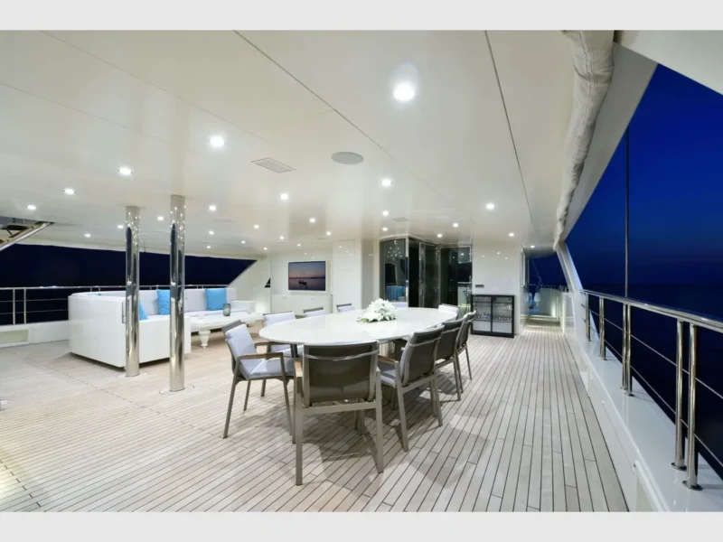 Meira motorsailer charter yacht outdoor upper deck dining table and lounge area