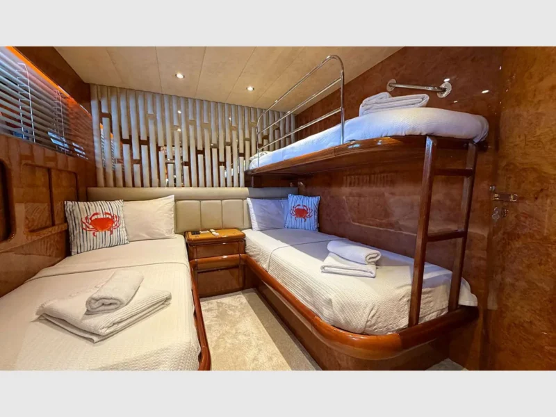 Admiral 115 Poseidon charter motor yacht interior twin cabin with a bunker bed