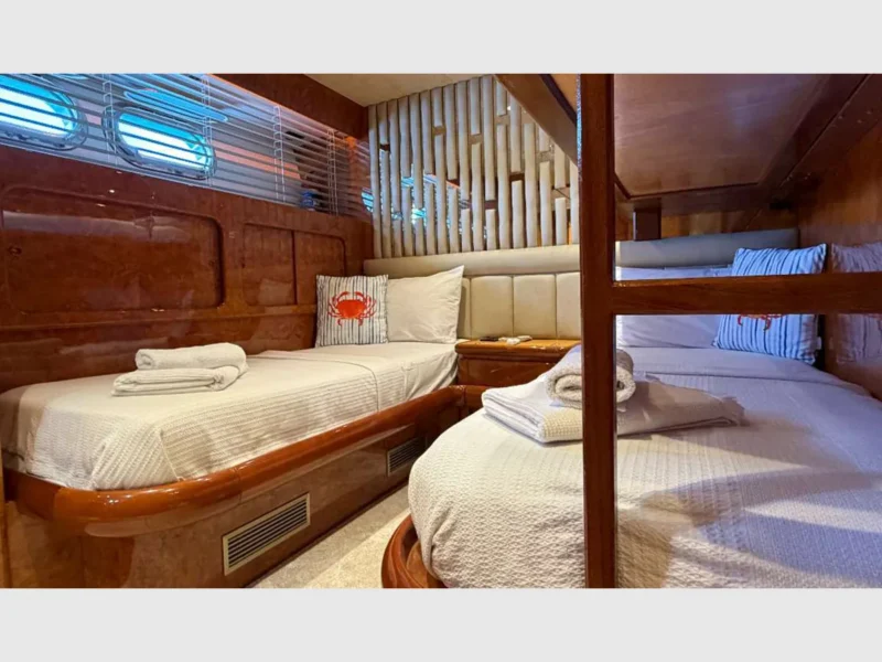 Admiral 115 Poseidon charter motor yacht interior twin cabin with a bunker bed