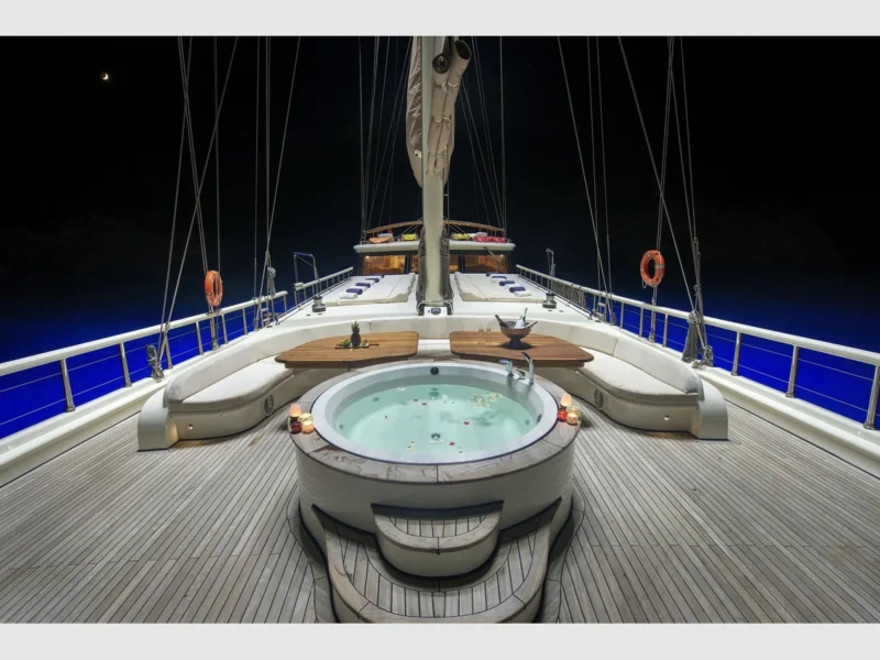 Queen of Salmakis gulet outdoor fore deck jacuzzi and sunbeds at night