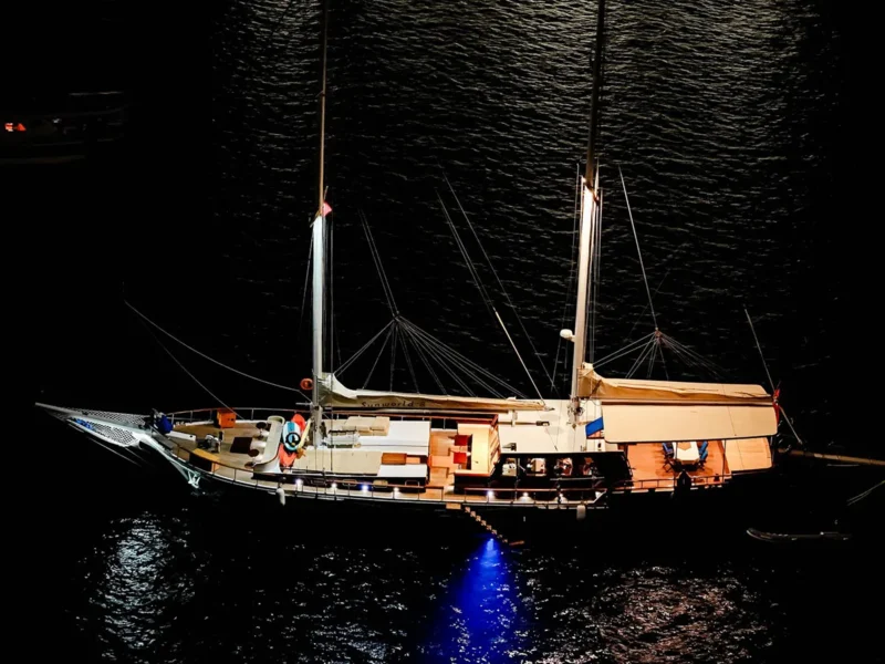 Sunworld 8 gulet charter yacht Bodrum, drone shot from port side at night